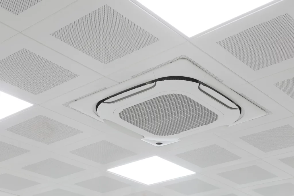 Cassette de climatisation à grille perforée au plafond